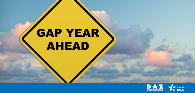 Photo of a road sign reading "Gap Year" against a cloudy sky; logos for DAZ and EducationUSA appear in the bottom right corner.